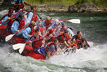 whitewater rafting by Ron Niebrugge: people in a raft, the front of which is partially submerged in white water, used with permission from the photogrpher, Ron Niebrugge