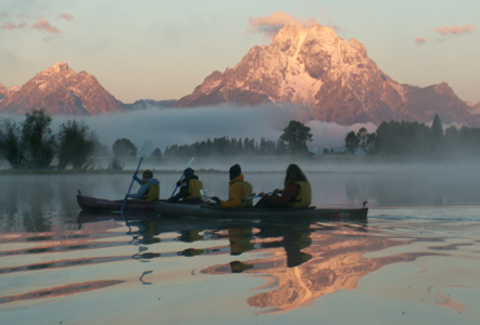 2005 oxbow bend pink sunrise kayaking into mist.: two kayaks with a pink sunrise and mist