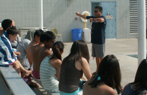 Coach Lugo EAP plan: Coach Tim Lugo addresses his swim students about the class emergency action plan