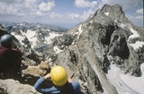 Mountain climbingTetons NPS photo: two climbers with helmets sit on a peak, photo courtesy of the national park service