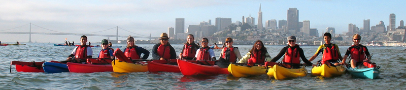lifeguard group photo on bay 2010 alcatri: row of kayakers on San Francisco bay with skyline in background