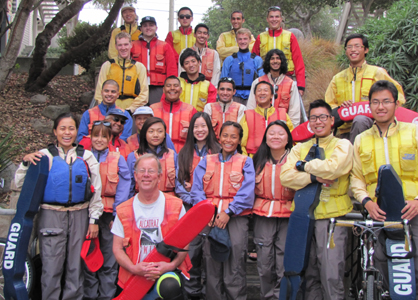 ocean kayak group photo oct 20 2013: kayakers, some with lifeguard rescue tubes, standing on steps