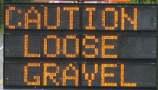 sign caution loose gravel: sign caution loose gravel