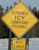 sign extremely icy conditions possible next 2 miles: sign that says extremely icy conditions possible next 2 miles