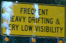 sign frequent heavy drifting: a road sign that says frequent heavy drifting (of snow) can be expected