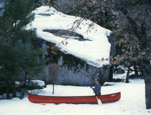 canoe in the snow: Would you believe white-water canoeing? (Note that he has his life-jacket on!)