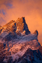 Grand teton sunrise by Ron Niebrugge: bright clouds behind the top of the Grand Teton peak, used with permission from the photographer, Ron Niebrugge