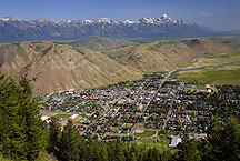 almost aerial of jackson, wyoming by Ron Niebrugge: the city of jackson, wyoming taken from a nearby peak, with the teton range just visible beyond a bluff overlooking the town. used with permission from the photographer, Ron Niebrugge