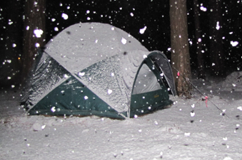 430 a.m. snowfall 2011: big snowflakes are seen falling, lit up by camera flash in front of tent