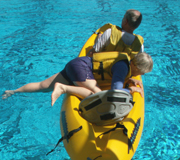 Georgine climbing into kayak: 