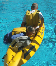 Georgine starting to climb into kayak: 