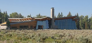 Grand Teton visitor center at Moose nps photo: sagebrush in foreground, building with two story windows