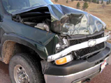 NPS photo Chevy after collision with a bison: NPS photo Chevy with front end damage after collision with a bison.