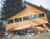 USGSphotocollapsedhome 134 pixels: upper story of a two story house collapsed into the garage during an earthquake