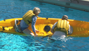 William starting to climb into kayak: 