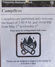 Yosemite campfire hours sign.: Yosemite campfire hours sign with an additional note that fires must be put out using water