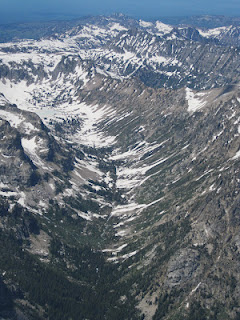 NPS photo cascade canyon from summit of grand teton june 28 2012: a canyon as seen from above with patchy snow