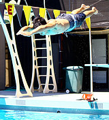 photo by Joyce Kuo diver summer PE 26C D class De Anza College: a diver takes off from a three meter diving board, caught in mid air