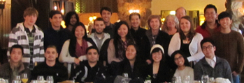 group photo brunch 2014 120 pixels: people standing behind and sitting at a dining table at the Ahwahnee hotel, Feb. 2014