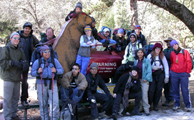 hikers pose with bear warning sign: hikers pose with bear warning sign shwoing a bear breaking inot a car that says Warning, this could happen to your vehicle