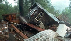 lomaprietaquakedamagehouse134pixels: a house titled on it's side after it slid off it's foundation