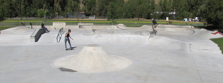 main bay Jackson Hole skate park: two skaters in skate park