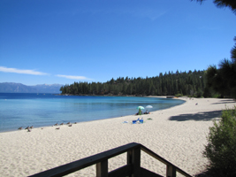 meeks bay beach: sandy beach on Lake Tahoe with a bit of a deck in the foreground