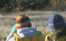 girls in kayak watch napping moose: 