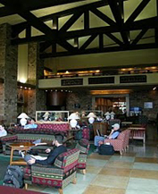 nps photo Jackson lake lodge upper lobby: people sitting on couches in room with two story high ceiling