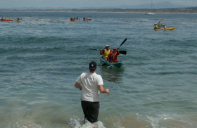 one kayak at a time comes in to shore 2006: 