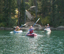 paddlers on Leigh lake with portage stairs in background: 