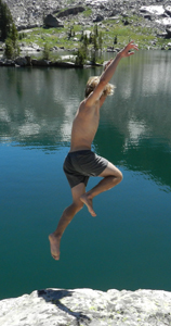 photo by Peter Ye Ethan Wilkie jumps into lake solitude: man jumps from granite rock into lake