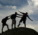 pushing Thad off a rock unknown photographer: two people pretend to push another off a huge rock