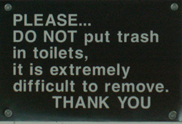 sign please do not put trash in toilets: 