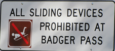 sign sliding devices prohibited: a sign that says all sliding devices prohibited at Badger Pass