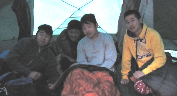 snow camp 2015 four people in tent.: sleepy people in a tent first thing in the morning