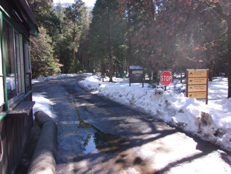 upper pines campground entrance winter 2016: road into a campground with kiosk and signs