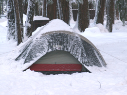yet another tent partially buried in the snow: 