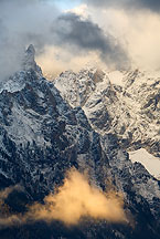 grand teton with bright cloud by Ron Niebrugge: snowy grand teton peak a with bright cloud in the lower foreground, used with permission from the photographer, Ron Niebrugge