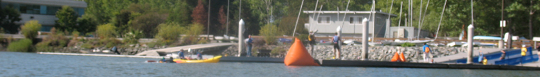 2009 Senior Games tri swim finish: 2009 Senior Games tri swim finish dock and a kayak of guards delivering a tired swimmer