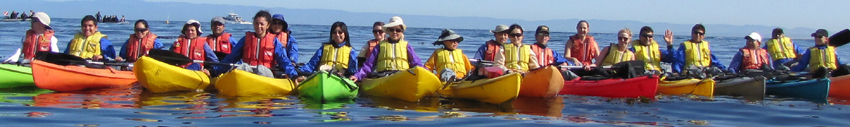 2010 De Anza ocean kayak trip group photo: ocean kayakers lined up in their boats for a group photo