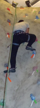 2011 tetons trip climbing.jpg: climber almost to the top of a climbing gym wall