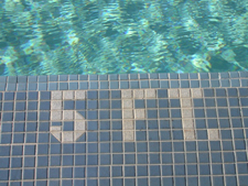 5 feet spelled in pool tiles: 