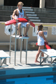 Alanna Klassen and Ethan Wilkie rotate guarding stations 3: one lifeguard in lifeguard stand while other rotates to another station