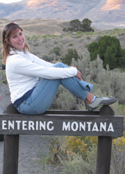 Alanna on Montana sign photo by Mark Nevill 250 pixels: girl sits on sign that says entering montana