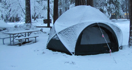 Cabella tent after snowfall winter 2011: snow covered tent and picnic table