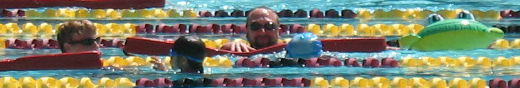 Ethan Wilkie and Ken Mignosa with SVKT swimmers: adult lifeguards swim with child triathletes photo by Alan Ahlstrand, Red Cross Lifeguard Instructor and Volunteer of Record for De Anza College
