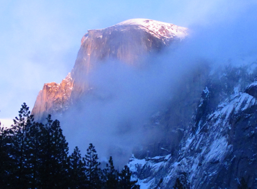 Half Dome from near campsite winter 2011: Half Dome with alpenglow and low clouds