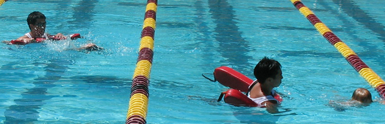 Herland Antezana and Jeremiah Chua at Kid's Tri: lifeguards swim next to youngest swimmers at children's triathlon photo by Alan Ahlstrand, Red Cross Lifeguard Instructor and Volunteer of Record for De Anza College