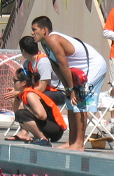 Javier Puente guarding Kid's triathlon: lifeguard and volunteers watch the pool photot by Alan Ahlstrand, Red Cross Lifeguard Instructor and Volunteer of Record for De Anza College